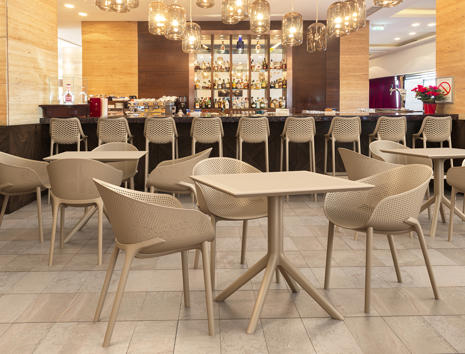 Sky Table 80 and Sky Chair Setting with Air Barstools in a Restaurant